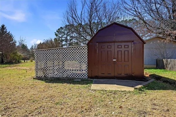 a wooden door with a yard