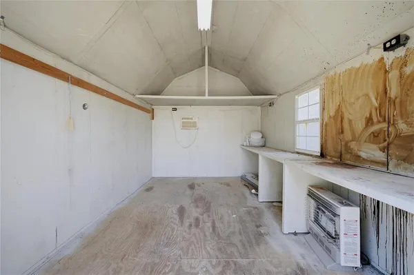 a view of a storage & utility room with a sink