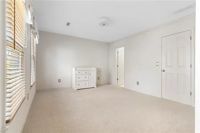 a bathroom with a tub sink a mirror a shower and vanity