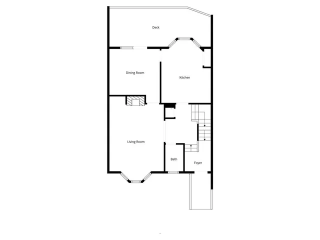 a view of a house with a floor to ceiling windows and a yard