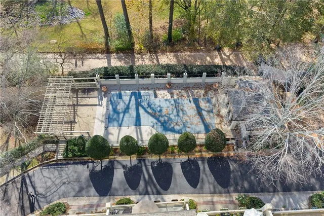 a view of a park with large trees