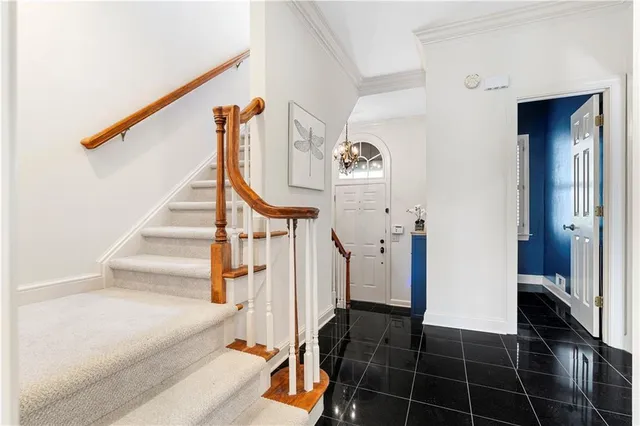 a view of entryway and hall with a sink