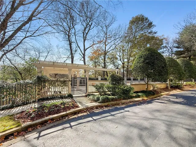 a view of a patio with chairs and plants
