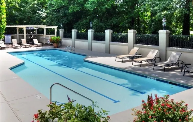 a view of a swimming pool with a patio