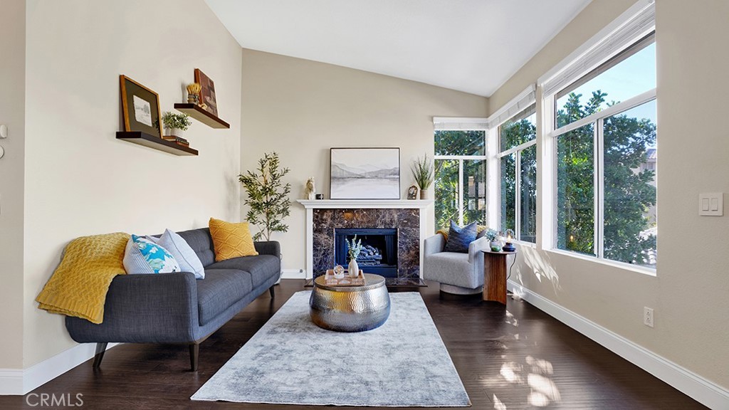 a living room with furniture and a fireplace