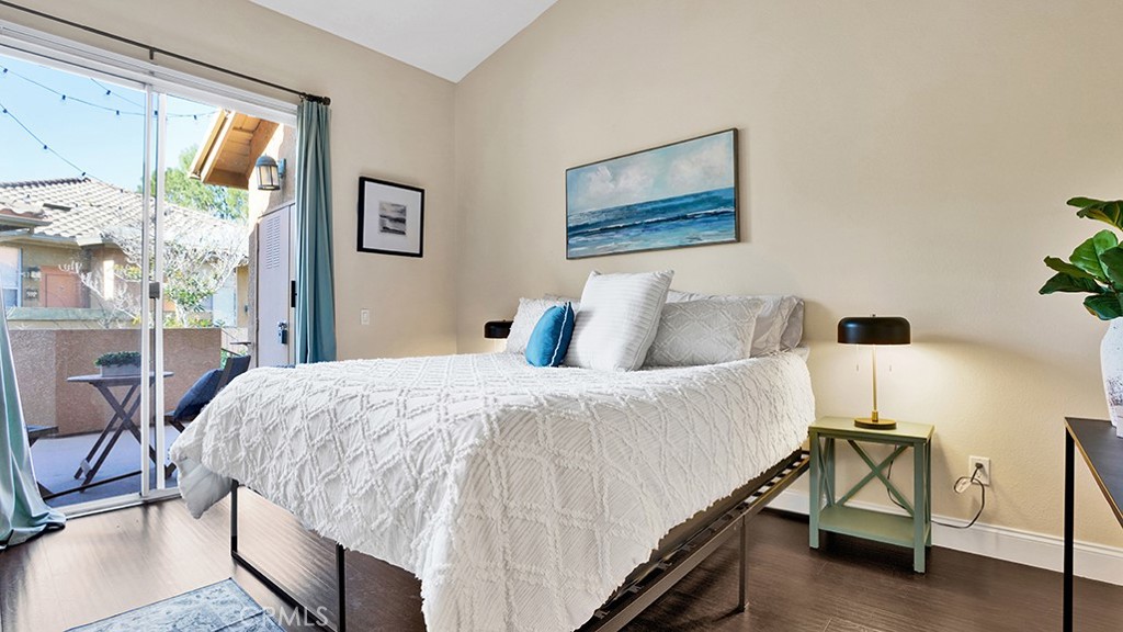 19431-57d Rue De Valore Lake Forest, CA 92610 - Photo 19 of 31 a bedroom with a bed and a large window