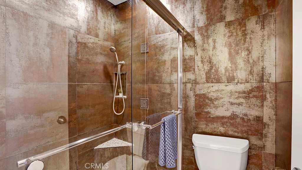 19431-57d Rue De Valore Lake Forest, CA 92610 - Photo 22 of 31 a bathroom with a toilet and shower