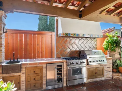 a backyard of a house with table and chairs