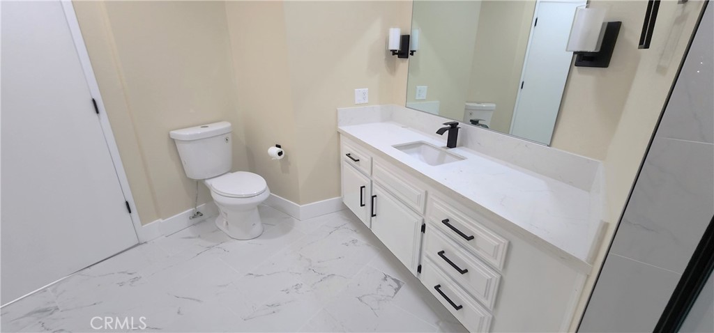 16257 St Timothy Road Apple Valley, CA 92307 - Photo 20 of 28 a bathroom with a sink and a mirror