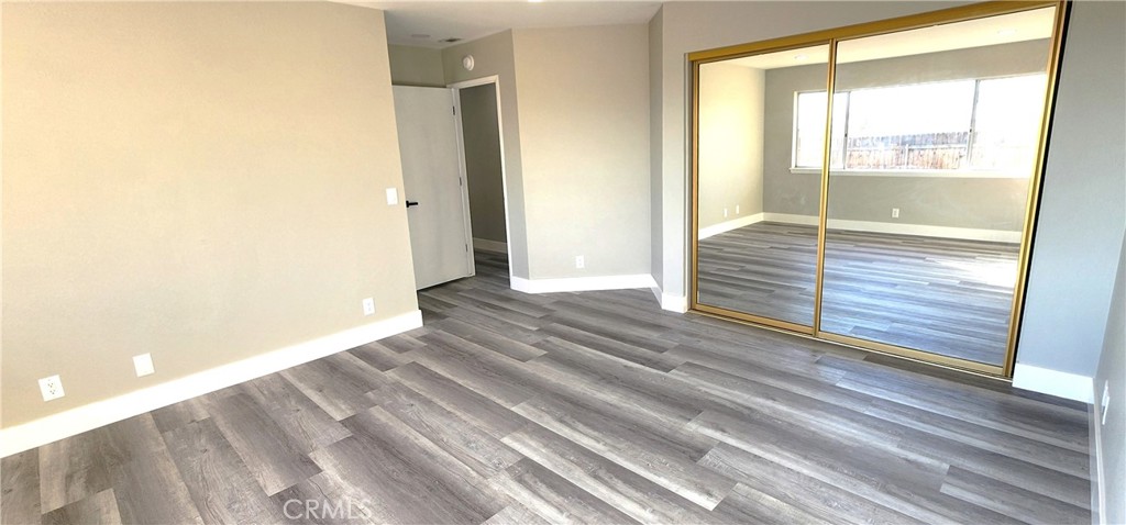 16257 St Timothy Road Apple Valley, CA 92307 - Photo 27 of 28 a view of wooden floor and windows in a room