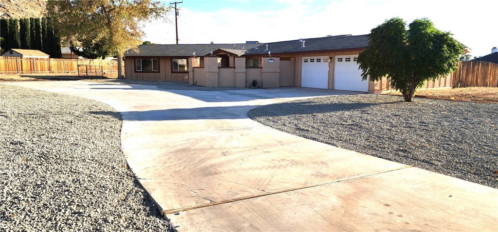 16257 St Timothy Road Apple Valley, CA 92307 - Photo 28 of 28 a view of a house with a yard