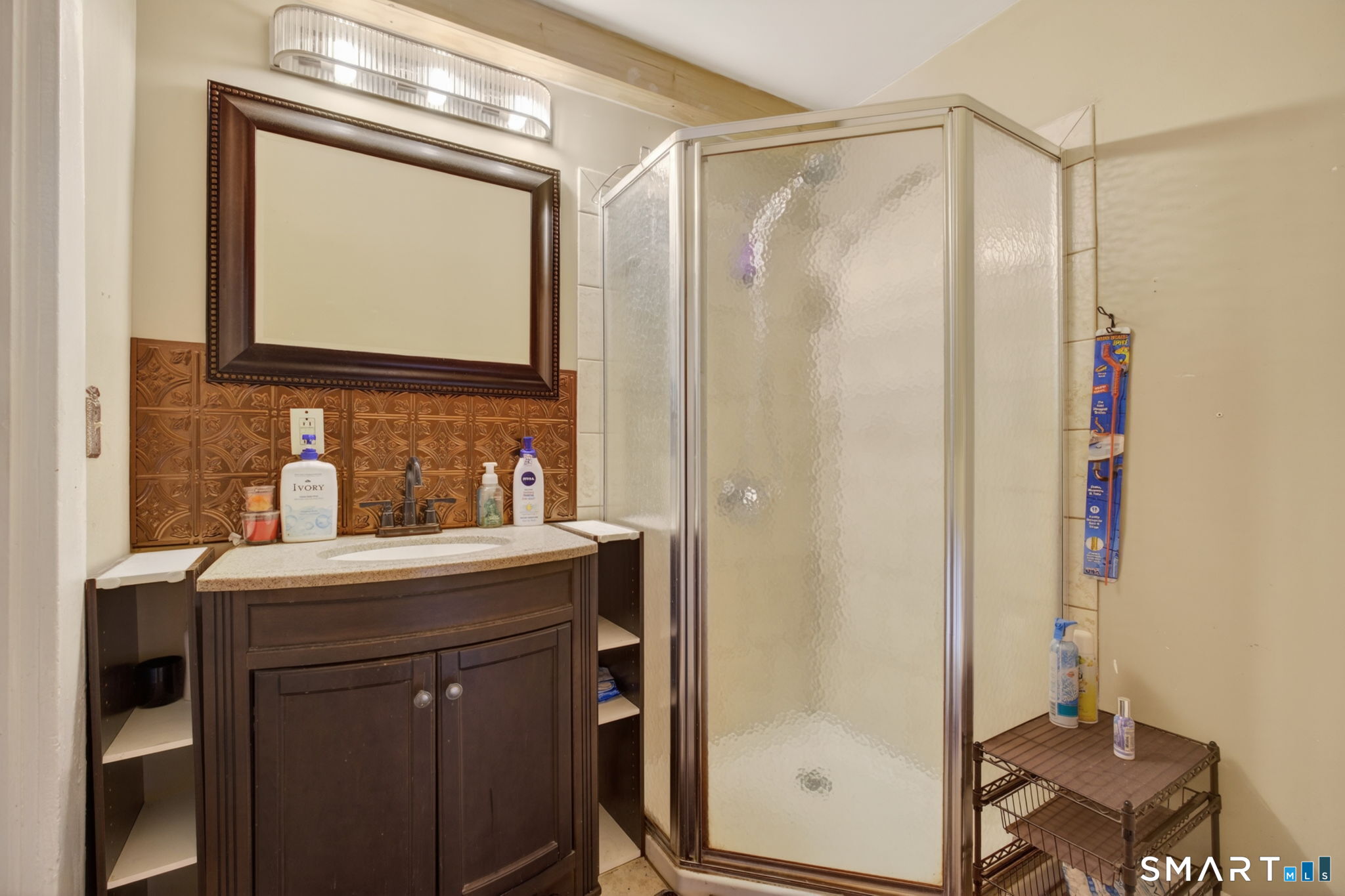 670 Hanover Road Meriden, CT 06451 - Photo 28 of 40 a bathroom with a sink vanity and a mirror