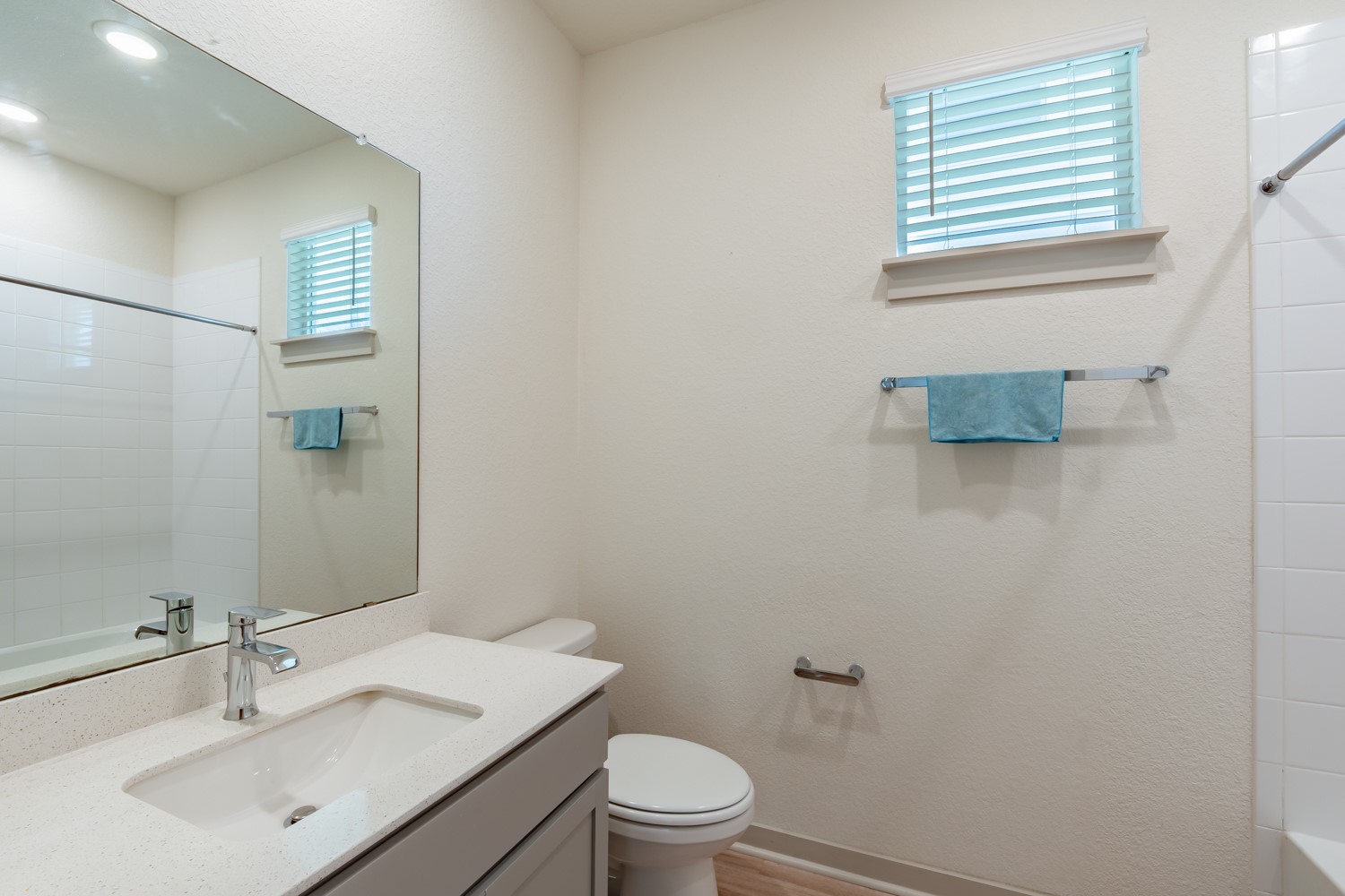 10801 Meris Lane Austin, TX 78754 - Photo 16 of 18 Bright and clean, this bathroom provides essential comforts and a pristine aesthetic.