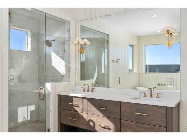 a bathroom with a sink a mirror and a toilet