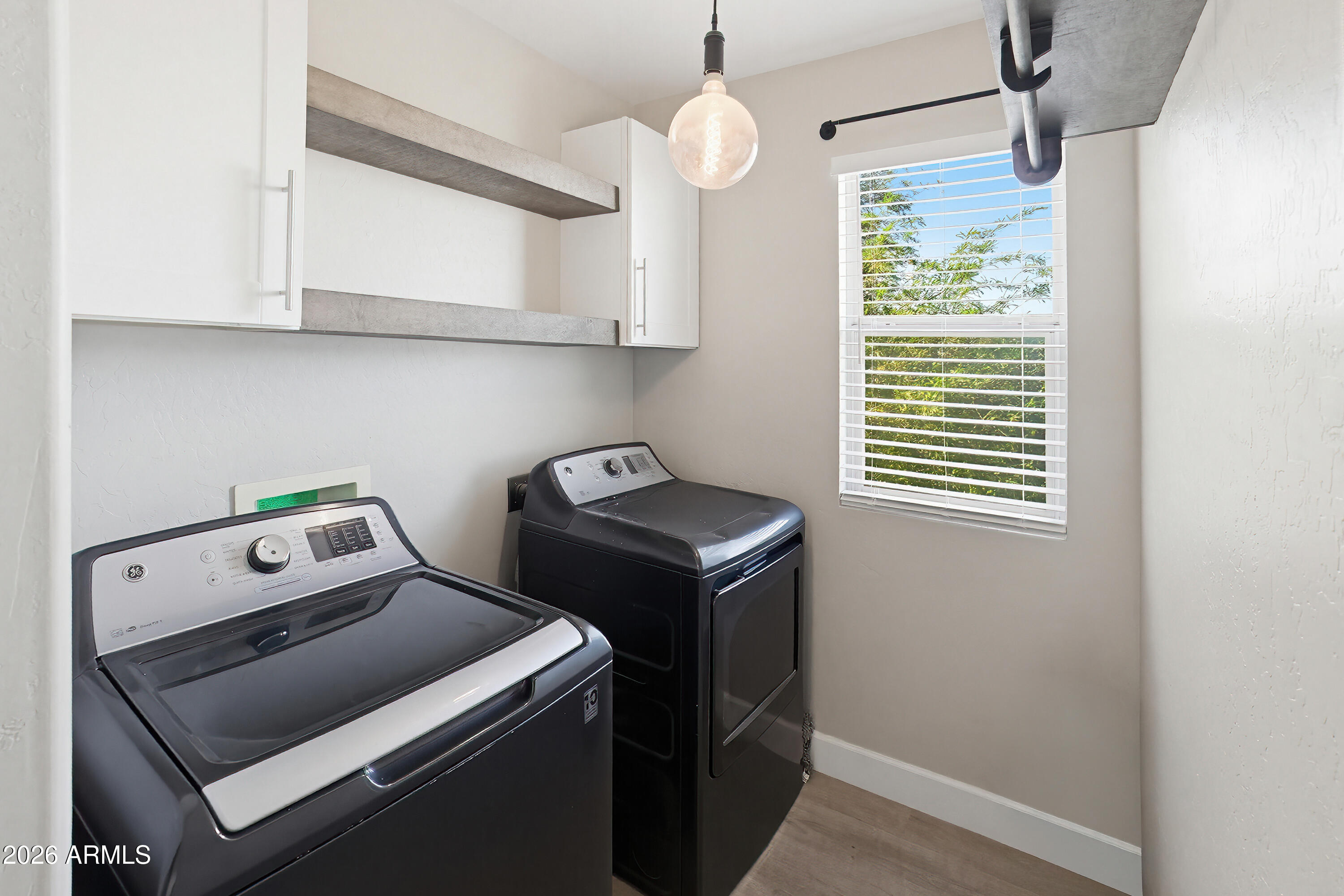 3818 West Carson Road Phoenix, AZ 85041 - Photo 17 of 41 a room with storage and utility