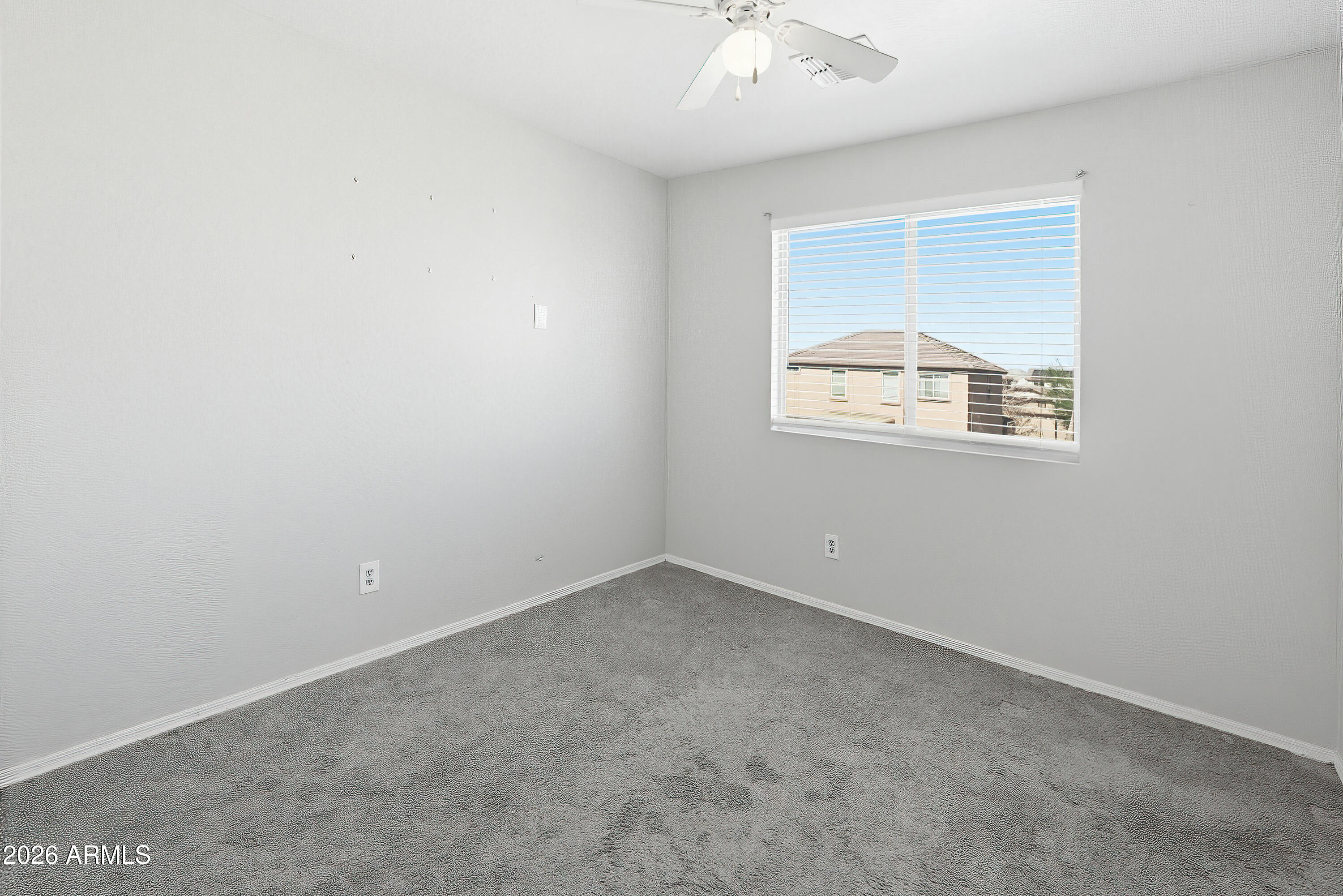 3818 West Carson Road Phoenix, AZ 85041 - Photo 18 of 41 an empty room with a window