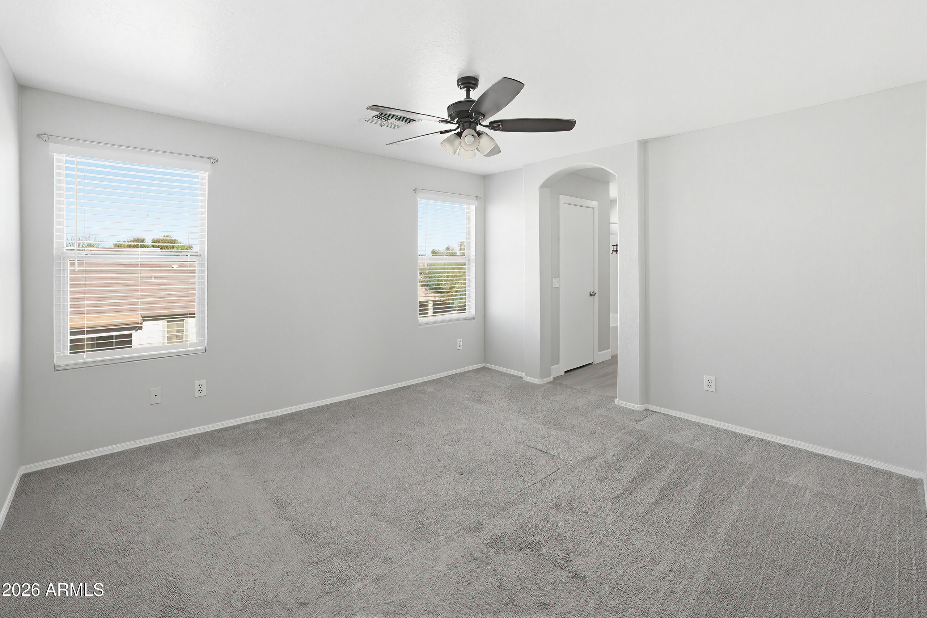 3818 West Carson Road Phoenix, AZ 85041 - Photo 20 of 41 a view of a livingroom with a ceiling fan and window