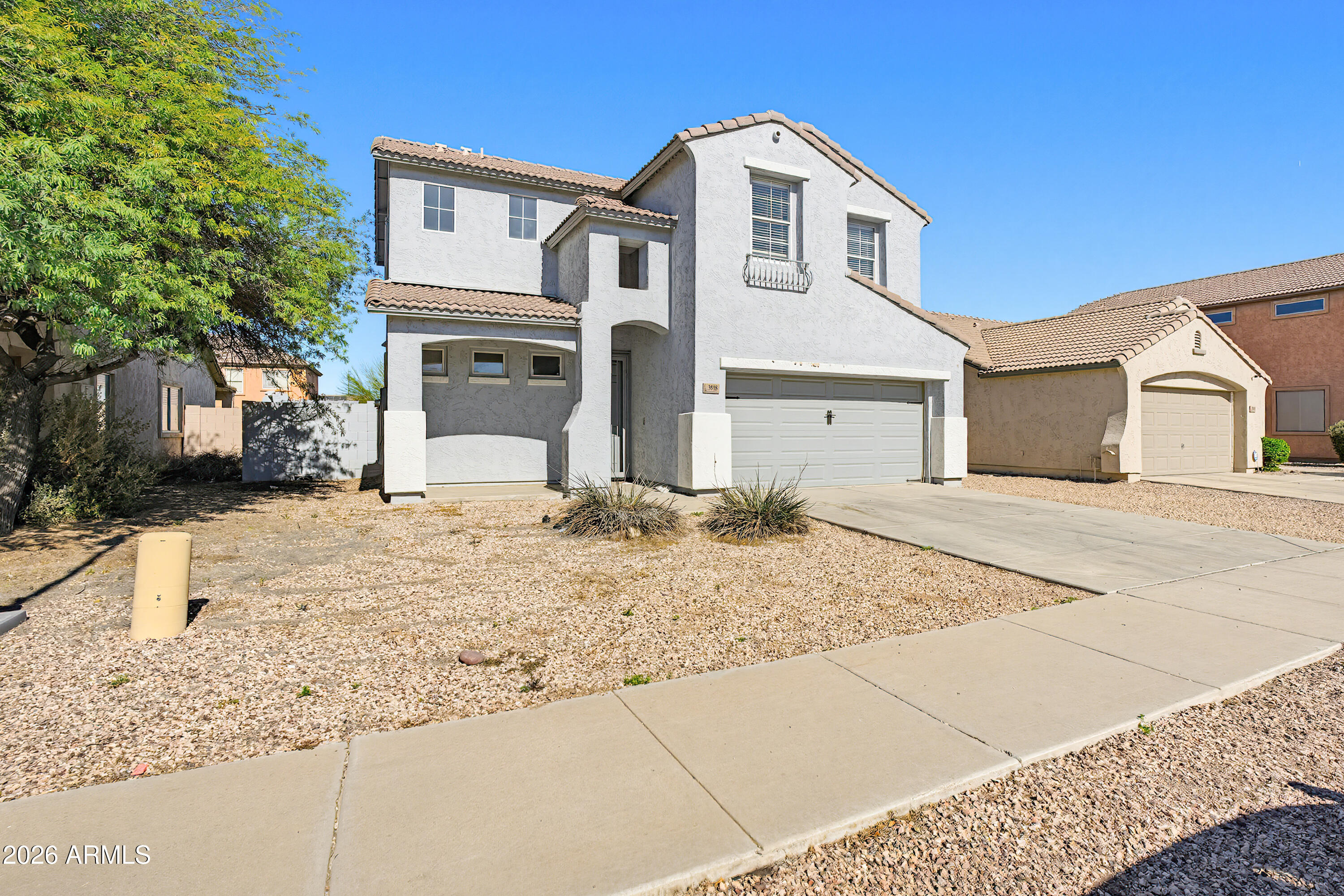 3818 West Carson Road Phoenix, AZ 85041 - Photo 2 of 41 a front view of a house with a yard