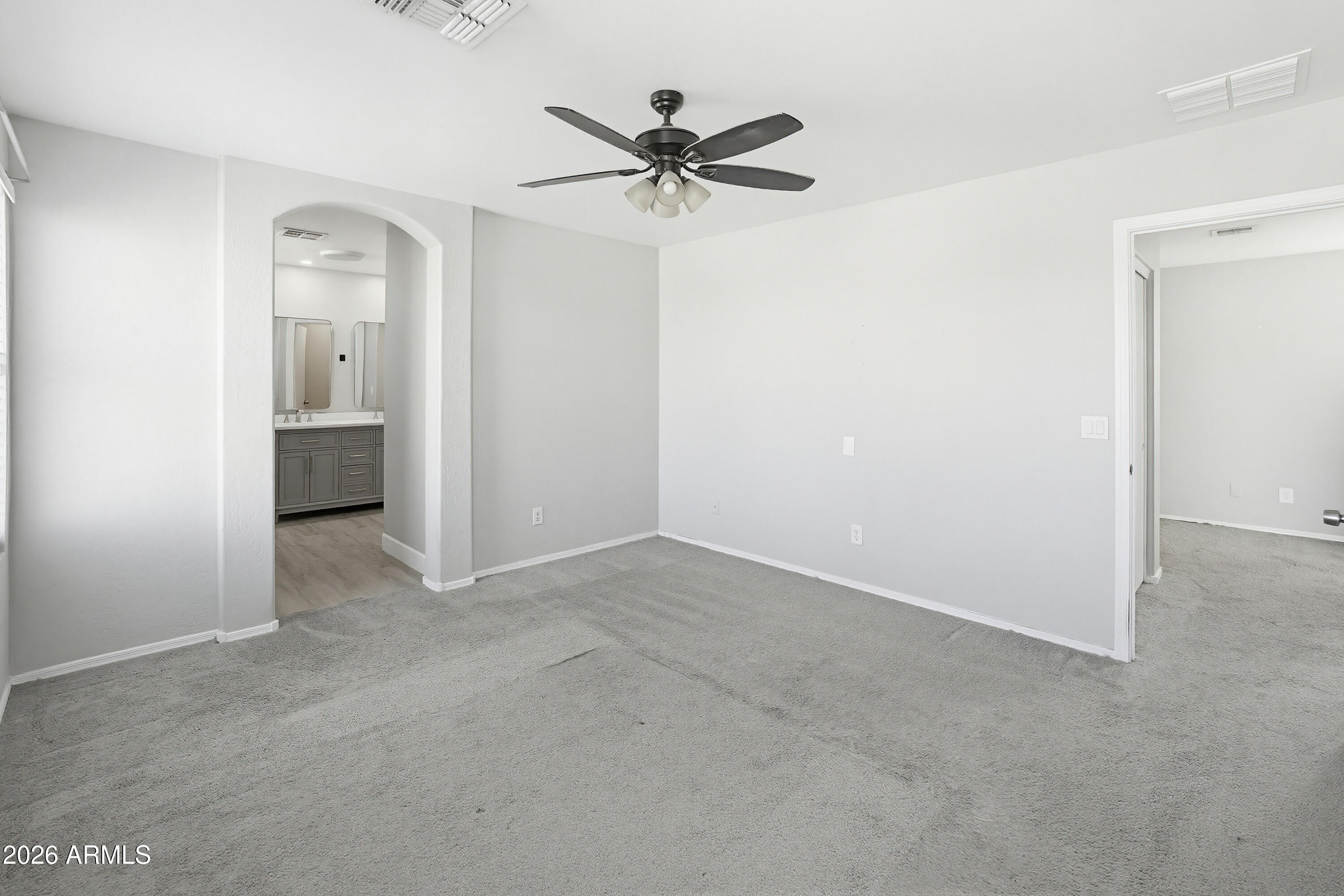 3818 West Carson Road Phoenix, AZ 85041 - Photo 21 of 41 a view of a livingroom with a ceiling fan and a window