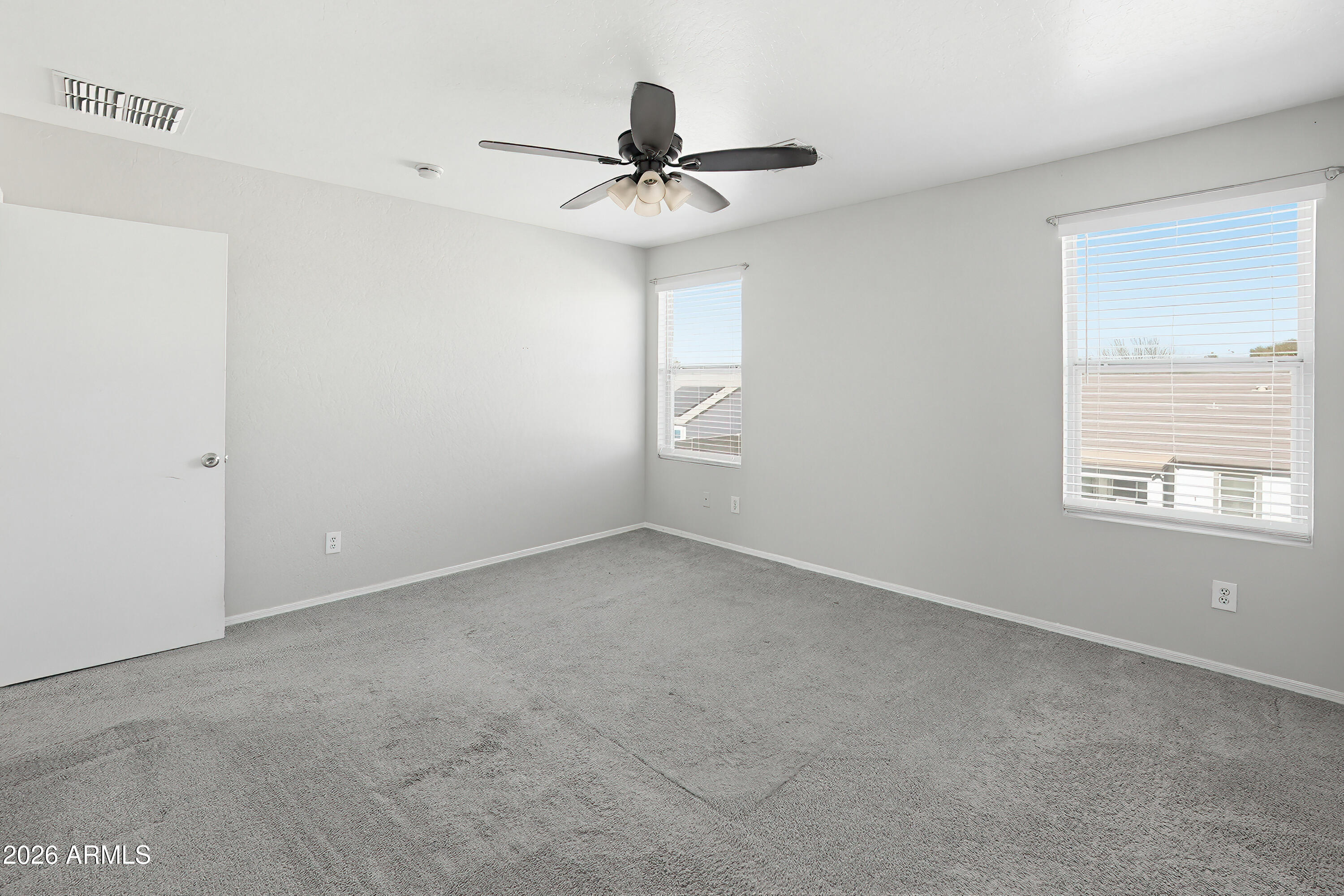3818 West Carson Road Phoenix, AZ 85041 - Photo 22 of 41 a view of a livingroom with a ceiling fan and window