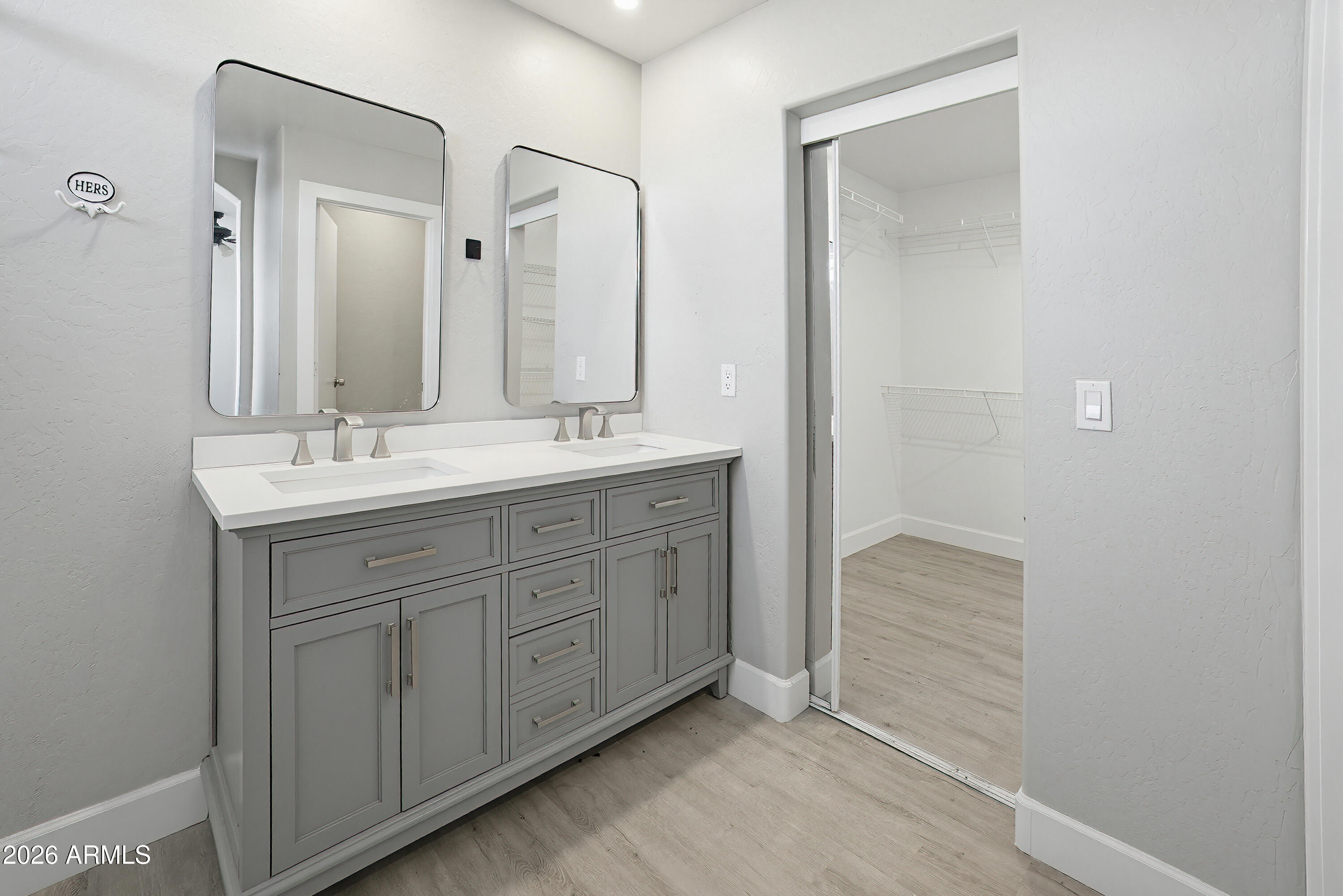 3818 West Carson Road Phoenix, AZ 85041 - Photo 23 of 41 a spacious bathroom with a double vanity sink and a mirror