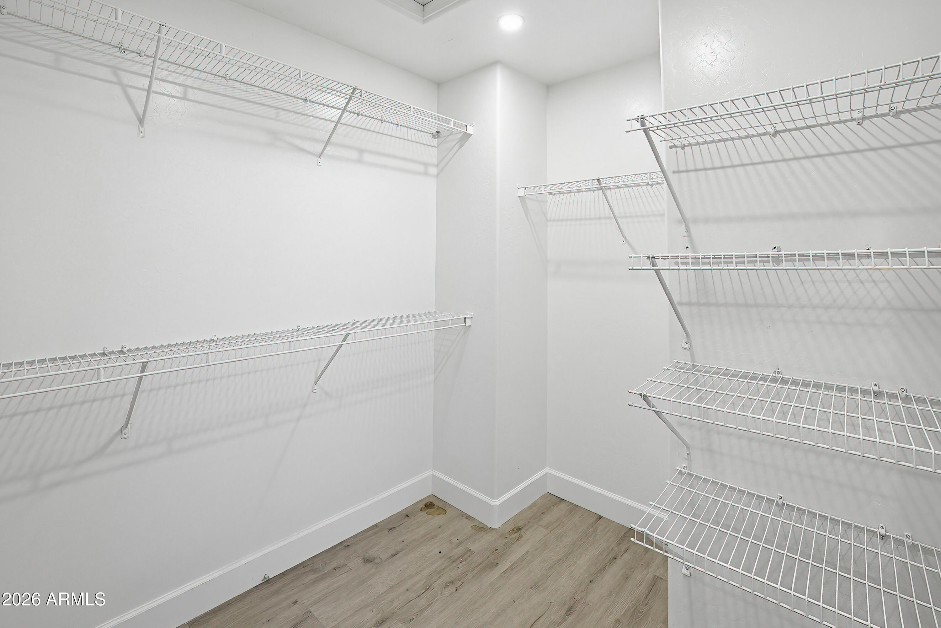 3818 West Carson Road Phoenix, AZ 85041 - Photo 24 of 41 a view of a room with racks on the wall