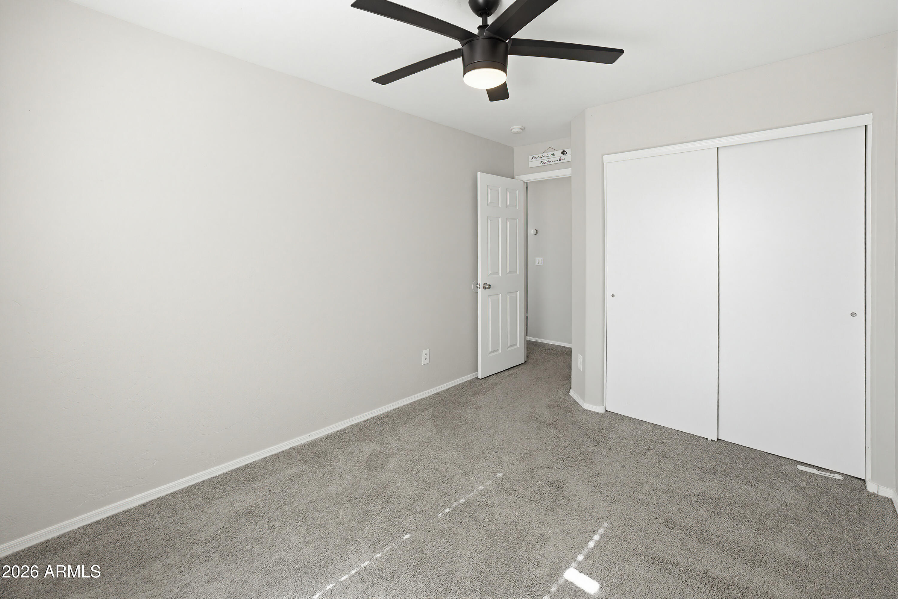 3818 West Carson Road Phoenix, AZ 85041 - Photo 29 of 41 a view of a room with a ceiling fan