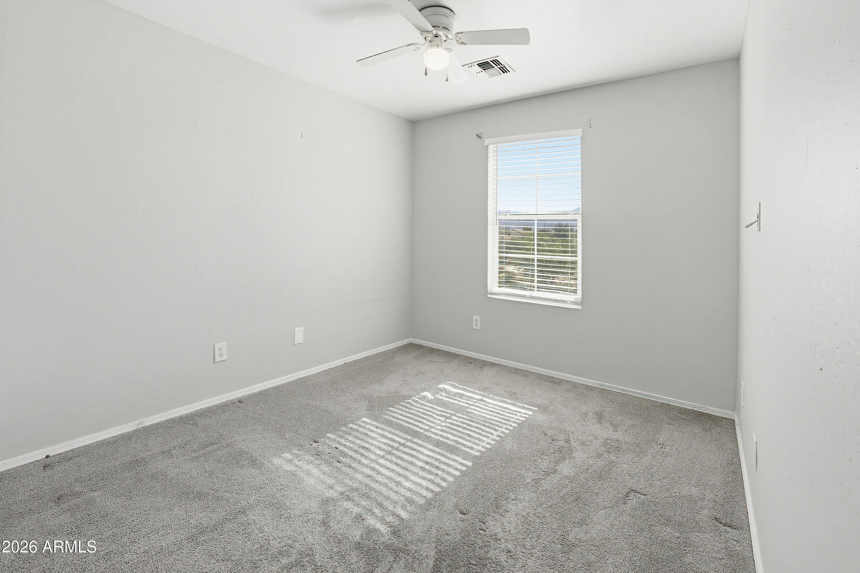 3818 West Carson Road Phoenix, AZ 85041 - Photo 31 of 41 an empty room with a window