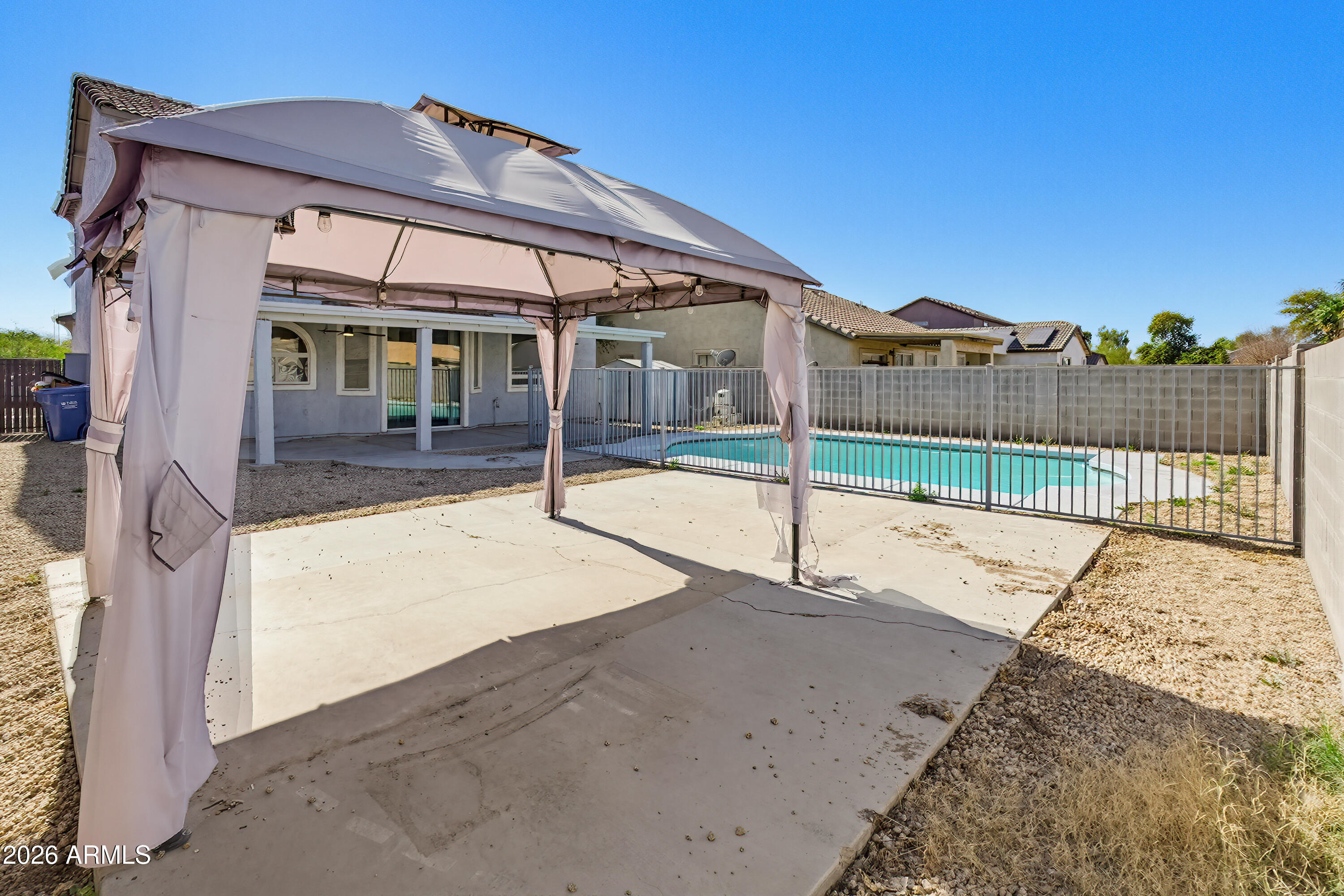 3818 West Carson Road Phoenix, AZ 85041 - Photo 37 of 41 a view of a house with a swimming pool