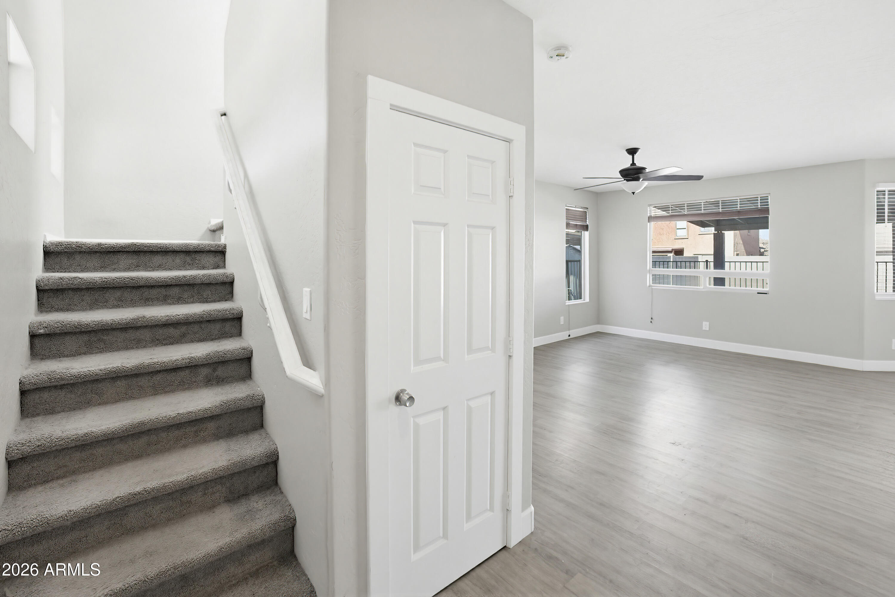 3818 West Carson Road Phoenix, AZ 85041 - Photo 4 of 41 a view of an entryway with wooden floor and staircase