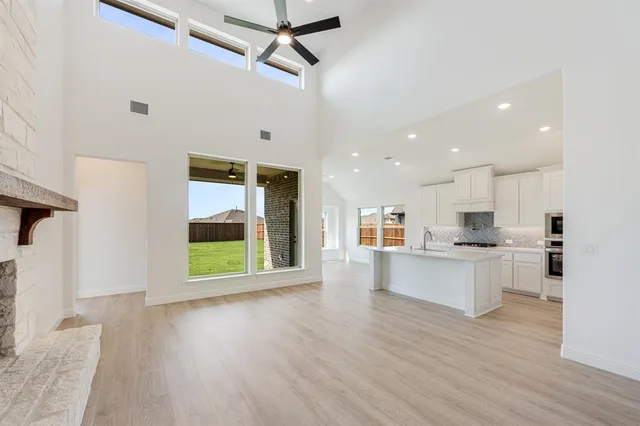 a view of a kitchen with a sink cabinets and a living room
