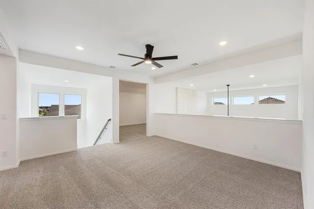 a view of a livingroom with a ceiling fan