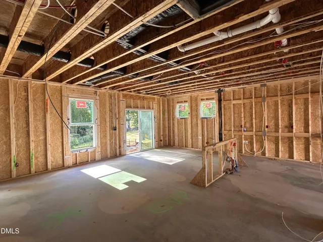 a view of an empty room with wooden walls