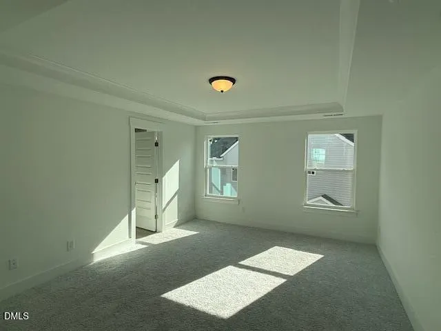 an empty room with windows and view