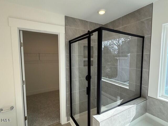 3500 Mount Court Raleigh, NC 27604 - Photo 8 of 15 a bathroom with a glass shower door and a bathtub