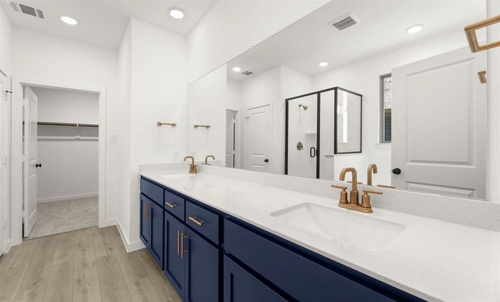 906 Colgate Circle Princeton, TX 75407 - Photo 11 of 16 a bathroom with a double vanity sink mirror and double