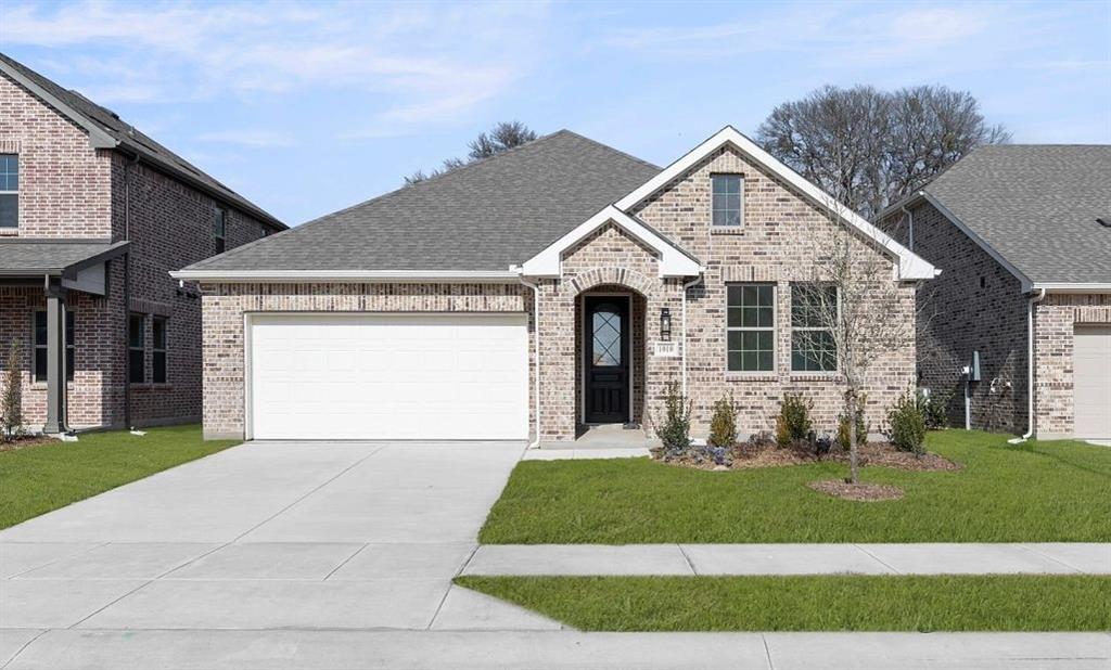 906 Colgate Circle Princeton, TX 75407 - Photo 2 of 16 a front view of a house with a yard and garage