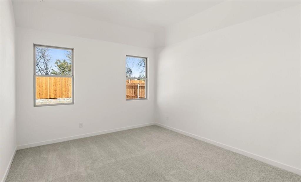 906 Colgate Circle Princeton, TX 75407 - Photo 10 of 16 an empty room with windows