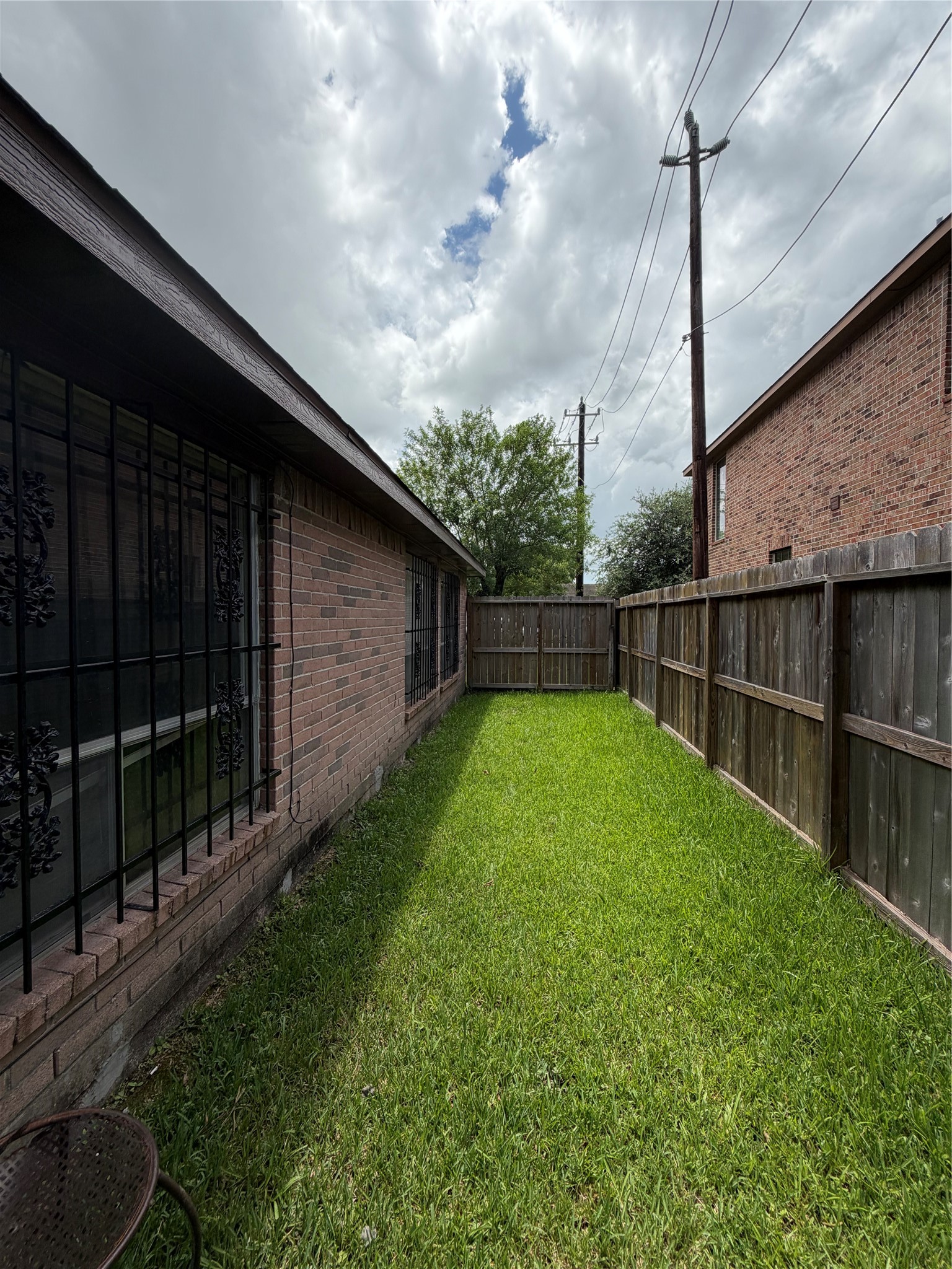 8662 Pearl Point Street Houston, TX 77044 - Photo 25 of 28 a view of a backyard with wooden fence