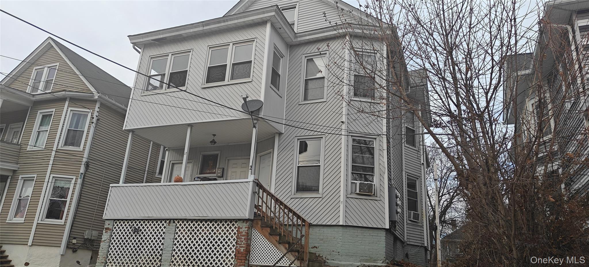 27 Franklin Street, Unit 1F Poughkeepsie, NY 12601 - Photo 6 of 7 View of front of home with stairway