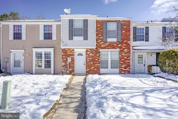 a view of a brick building with many windows