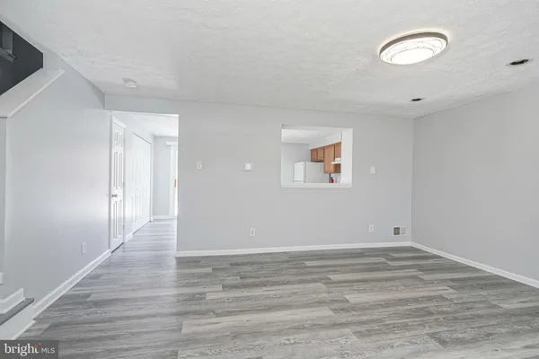 a view of room with window and ceiling fan
