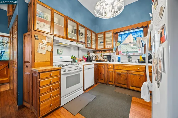 a kitchen with cabinets and window
