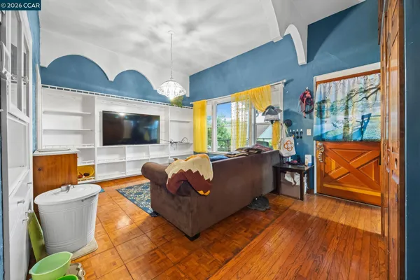 a living room with furniture and a flat screen tv