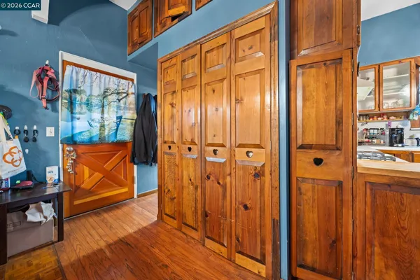 a view of front door with wooden door