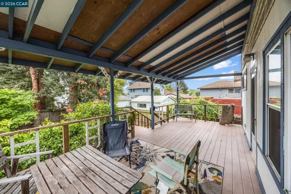 a view of a patio with wooden floor