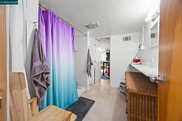 a bed room with a bed and a desk