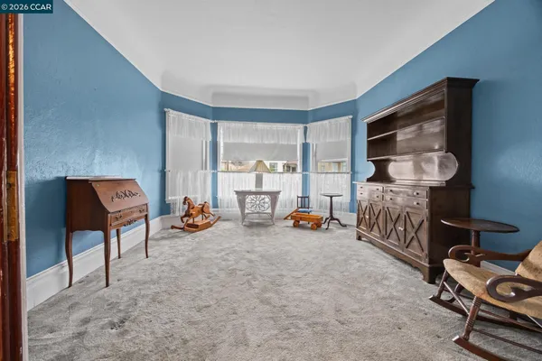 a bedroom with furniture and a window