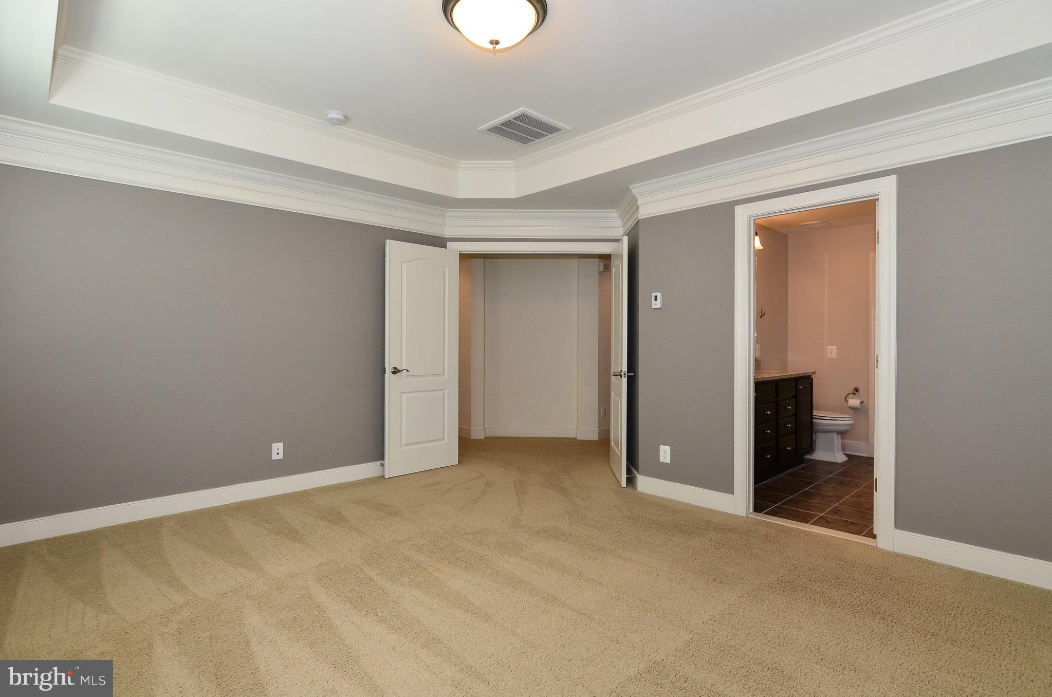 5785 Hunting Creek Road Alexandria, VA 22303 - Photo 17 of 28 Large Master Bedroom with dual doors, tray ceiling
