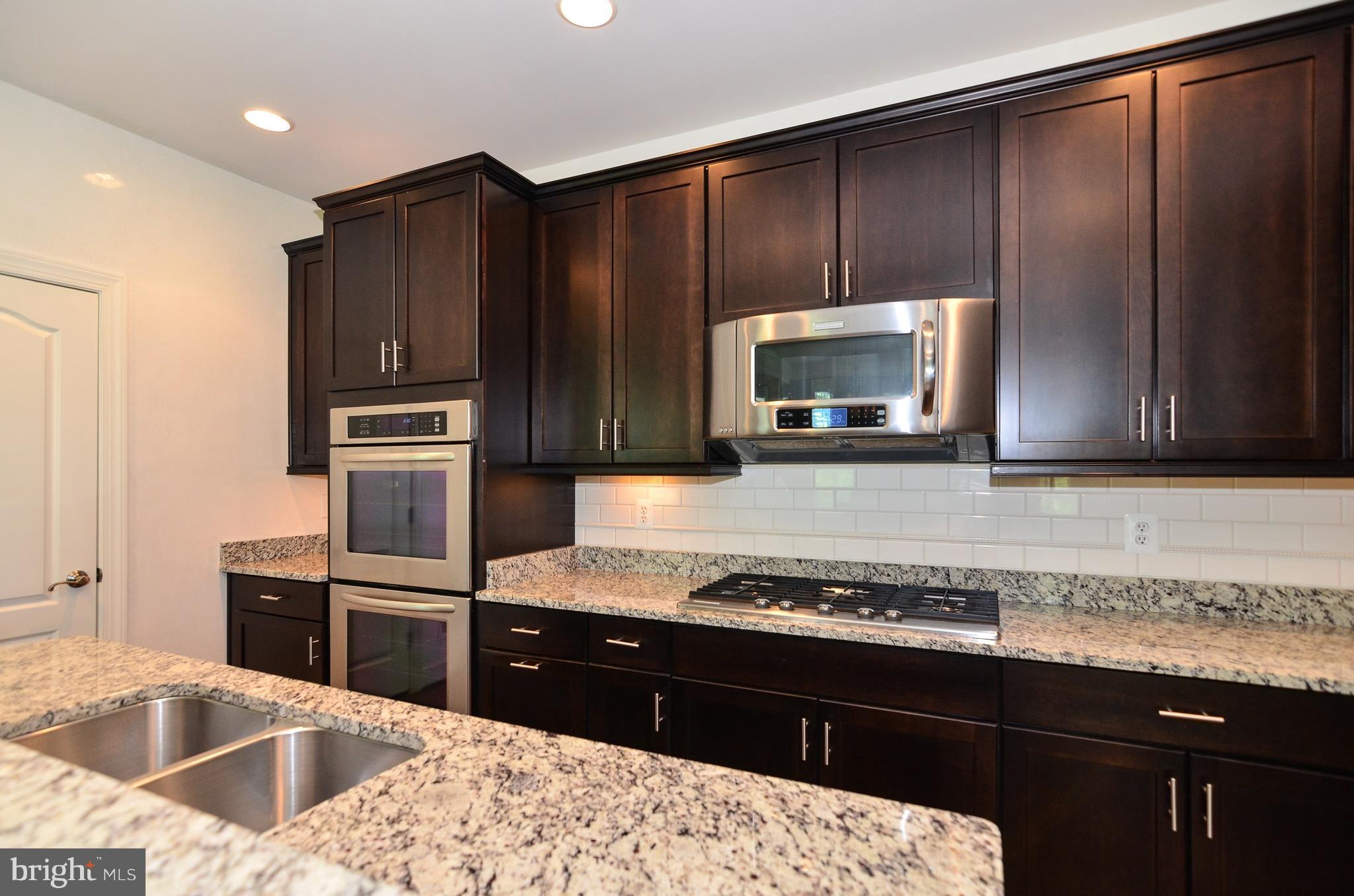 5785 Hunting Creek Road Alexandria, VA 22303 - Photo 8 of 28 Kitchen with double oven, gas cooktop